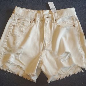 White ripped shorts